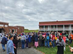 Group of people helping to change the flag during Fife and Drum Rehearsal at Fort McHenry