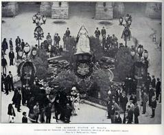 Statue of the Queen in Malta surrounded by wreaths and mourning emblems