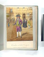 Chevalier in Bourgeois attire standing near a section of a library with shelves of books