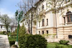 Cotroceni Palace exterior with lush garden and statue
