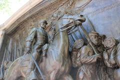 Statue of Robert Gould Shaw on horseback leading the Massachusetts 54th Regiment of African American soldiers marching with muskets and drums at the Robert Gould Shaw and Massachusetts 54th Regiment Memorial in Boston