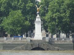 River Thames with historic monument and textured cloudy sky in London
