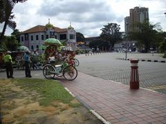 Cobble-stone roads of Melaka city with unique cycle-rickshaws featuring inbuilt music systems for tourist rides