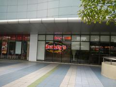 SM City North EDSA mall exterior along North Avenue in Quezon City with West North Footbridge and EDSA interchange
