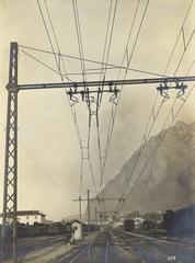 Lecco railway station building with trains and tracks
