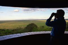 U.S. Secretary of State John Kerry observing a rhinoceros in Nairobi National Park, Kenya