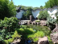 Beautiful elements of The New York Chinese Scholar's Garden with traditional Chinese architecture and lush greenery