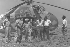 Prime Minister David Ben Gurion arriving by army helicopter at Hatzor to visit archaeological excavations with Dr. Yigael Yadin and Mr. Shimon Peres