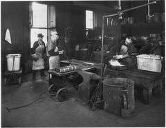 Worker treating gold in a refinery