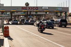 Border crossing at San Ysidro, busy lane with cars and people