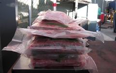 U.S. Customs and Border Protection officers inspecting narcotics hidden in a vehicle at San Ysidro port of entry