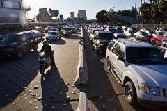 Busy San Ysidro border crossing at the US-Mexico border with vehicles and people