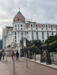 Hôtel Négresco in Nice with pink dome and classic architecture under a bright blue sky in March 2022