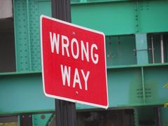 Wrong Way road sign on off-ramp from I-93 northbound in Boston with Science Park station in background
