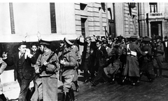 Captured Nazis being led to the Caja del Seguro at the University of Chile on September 5, 1938