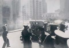 Carabineros firing machine guns at Seguro Obrero assailants in 1938