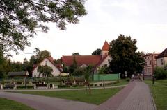 Scenic view of Mrągowo, Poland with colorful lakeside buildings and lush greenery