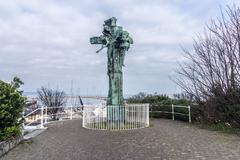 Statue of Christ the King by O'Connor under a cloudy sky
