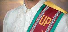 Graduate wearing Sablay ceremonial sash from University of the Philippines