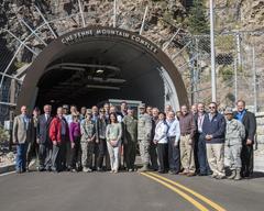 10th Air Force Civilian Leader tour group photo with members standing and smiling outdoors