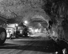 Historical photo of Cheyenne Mountain tunnel construction in April 1962 with construction equipment and workers