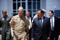 Secretary of Defense Leon E. Panetta walking with Commander of NORAD and U.S. Northern Command Adm. James Winnefeld Jr. at Peterson Air Force Base in 2011