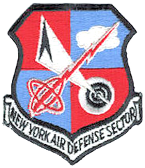 Emblem of the New York Air Defense Center featuring a shield with a yellow eagle and blue background
