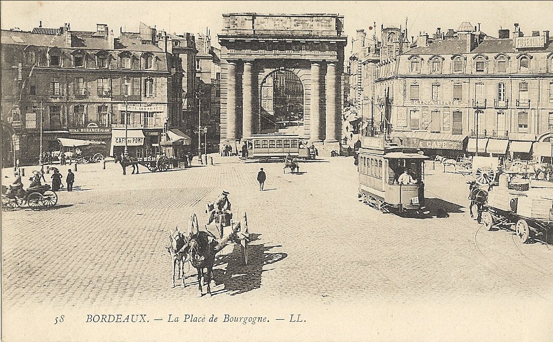 Historic Bordeaux Porte de Bourgogne gate in 1905 with vintage cars and pedestrians