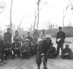 Chinese farmer sharing agricultural knowledge with students at Shandong Agricultural College in 1957