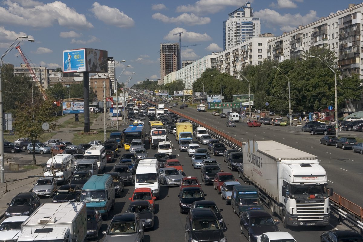 Wide view of Peremohy Avenue in Kiev with multiple lanes and traffic under a blue sky