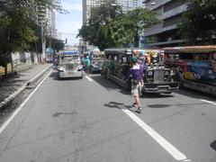 Ortigas Center in Mandaluyong City, Philippines with high-rise buildings along San Miguel Avenue and Shaw Boulevard at Radial Road 5 and Circumferential Road 5