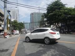 Shaw Boulevard in Pasig City with heavy traffic, buildings and trees along the roadside