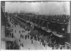 Historic crowd of people watching the 1914 World Series game from roofs of Philadelphia rowhouses