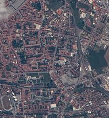 Aerial view of Piazza dei Miracoli in Pisa, Italy featuring the Leaning Tower and surrounding landmarks as seen from the International Space Station during Expedition 65