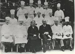 Group photo of Gundel restaurant staff including chefs and owners