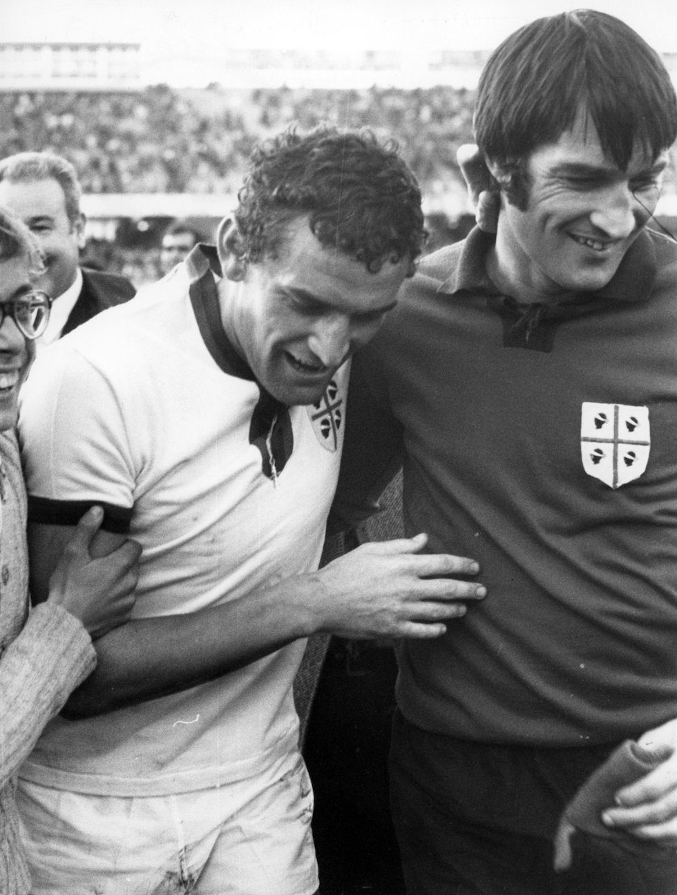 Cagliari Calcio forward Luigi Riva and goalkeeper Enrico Albertosi leaving the pitch at Sant'Elia Stadium after a 2-1 victory over Juventus during 1971-72 Serie A