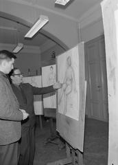 Finnish art student Göran Augustson receiving instructions from teacher Sam Vanni at Finnish Art Academy School Ateneum in Helsinki