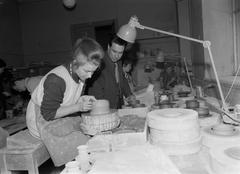 Photograph of Finnish ceramics student Liisa Seitsonen and principal Markus Visanti at Finnish Art Academy School Ateneum ceramics department