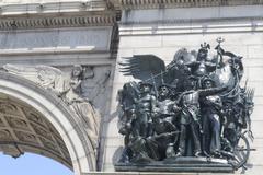 Close-up of Soldiers and Sailors Memorial Arch detail with bronze sculpture and protective netting at Grand Army Plaza, Brooklyn