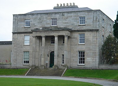 Exterior view of Pearse Museum in Dublin with brick facade and greenery