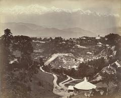 Historic photograph of Darjeeling town with the snowy Himalayan range and Kanchenjunga peak visible in the distance