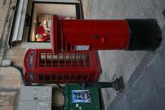 Red telephone booth and red mailbox in Valletta