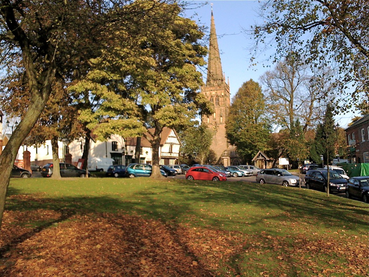 Kings Norton Green and St Nicolas Church surrounded by autumnal leaves