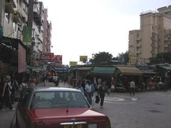 Colorful souvenir shops and tourists at Stanley Market, Hong Kong
