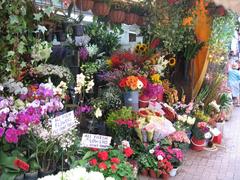Bustling daytime market scene at Stanley Market with colorful stalls and shoppers