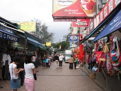 Stanley Market street with shops and pedestrians in Hong Kong