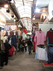 View of Stanley Market street with stalls and shoppers in Stanley, Hong Kong