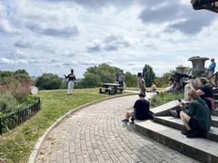Fort McHenry Guard playing fifes and drums at Patterson Park with visitors and rangers watching