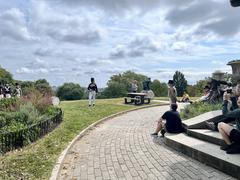 Fort McHenry Guard playing fifes and drums at Patterson Park with visitors and rangers watching
