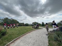 Fort McHenry Guard playing fifes and drums at Patterson Park with visitors and rangers watching